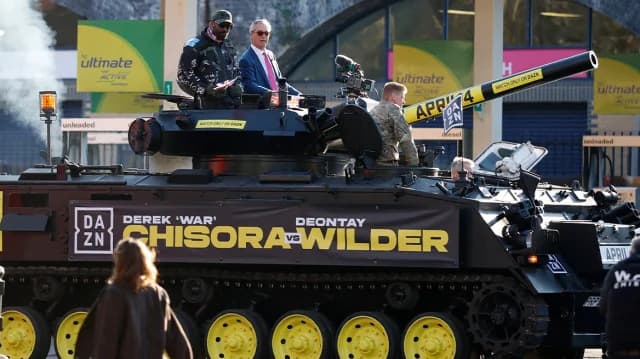 Derek Chisora Arrives at Press Conference in a Tank