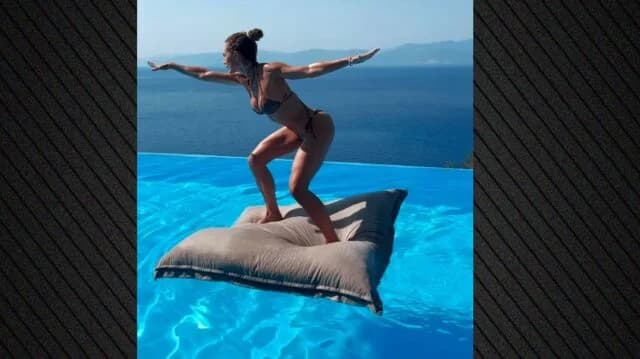 Doretta Papadimitriou relaxes in the pool and answers emails