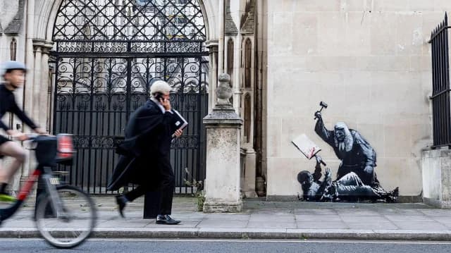 Banksy Graffiti at London Courts Sparks Reactions