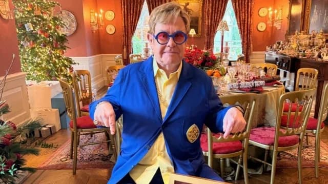 Elton John Celebrates Christmas with Platinum Award for 'Step Into Christmas'